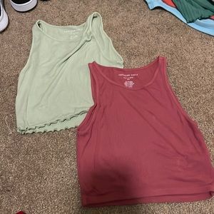 mint green and dark pink American Eagle crop tops